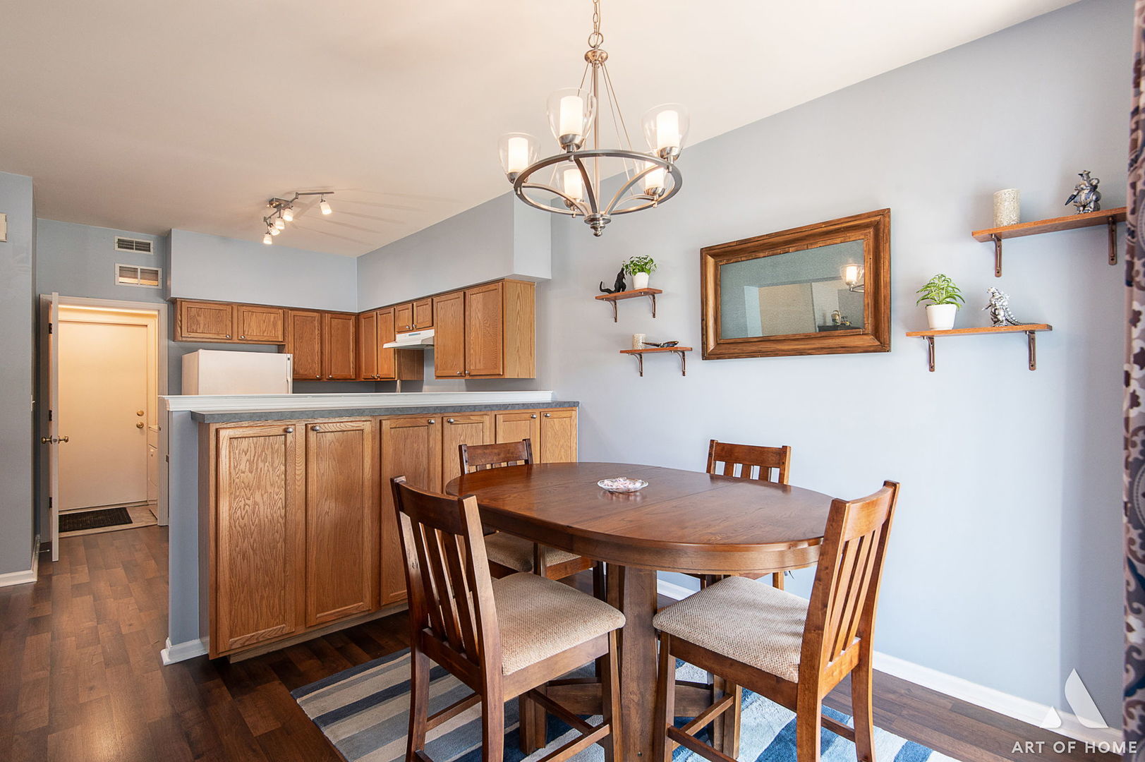 169 Braxton Lane Aurora, IL 60504 - Photo 14 of 26 a view of a dining room with furniture wooden floor and chandelier