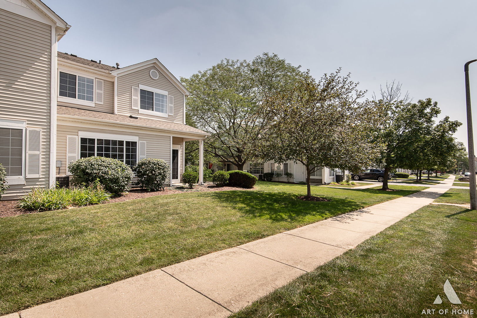 169 Braxton Lane Aurora, IL 60504 - Photo 4 of 26 a front view of house with yard and green space
