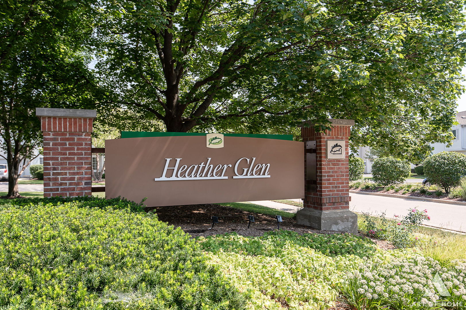 169 Braxton Lane Aurora, IL 60504 - Photo 5 of 26 a sign that is sitting in front of a tree