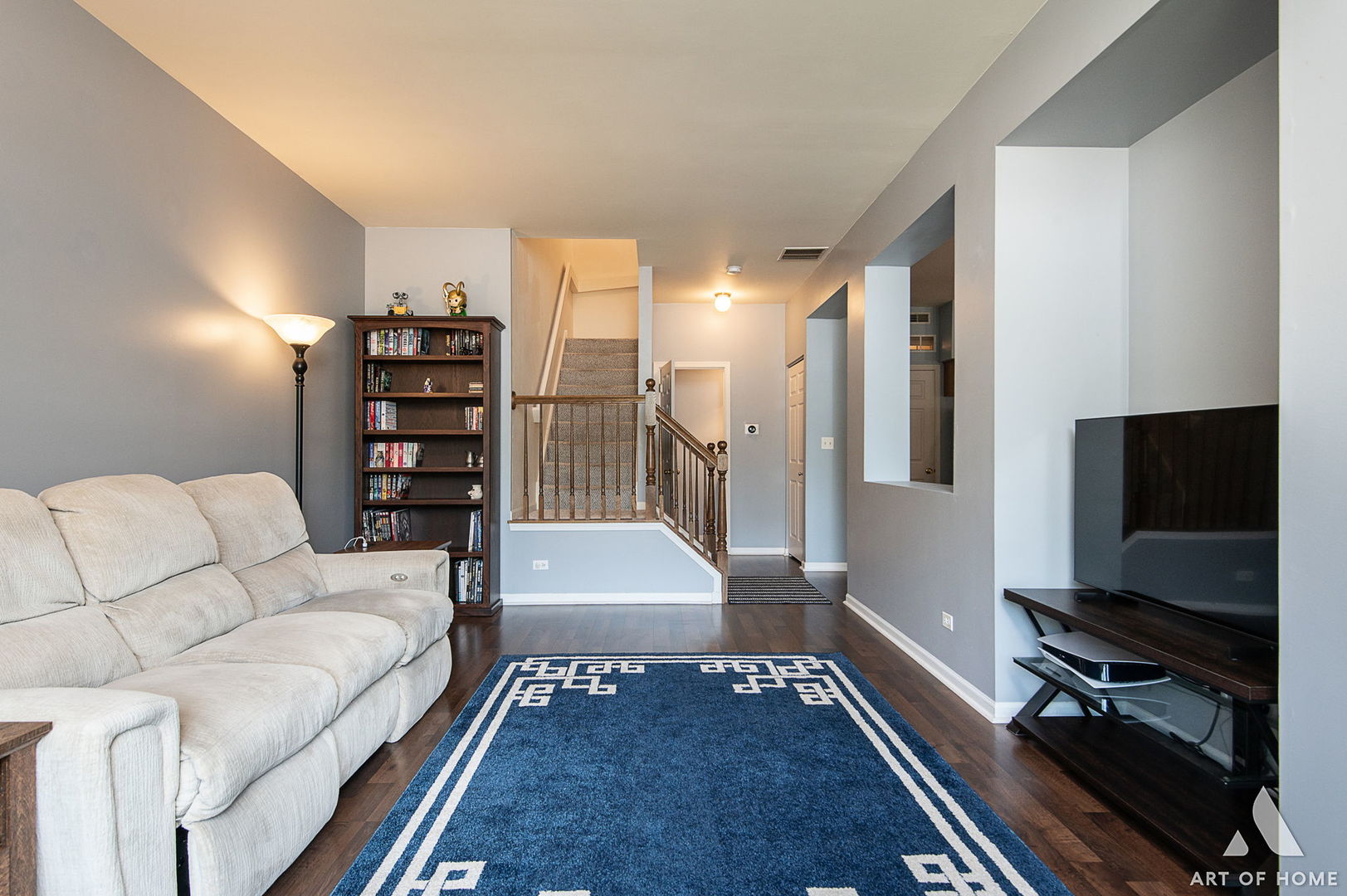 169 Braxton Lane Aurora, IL 60504 - Photo 7 of 26 a living room with furniture and a flat screen tv