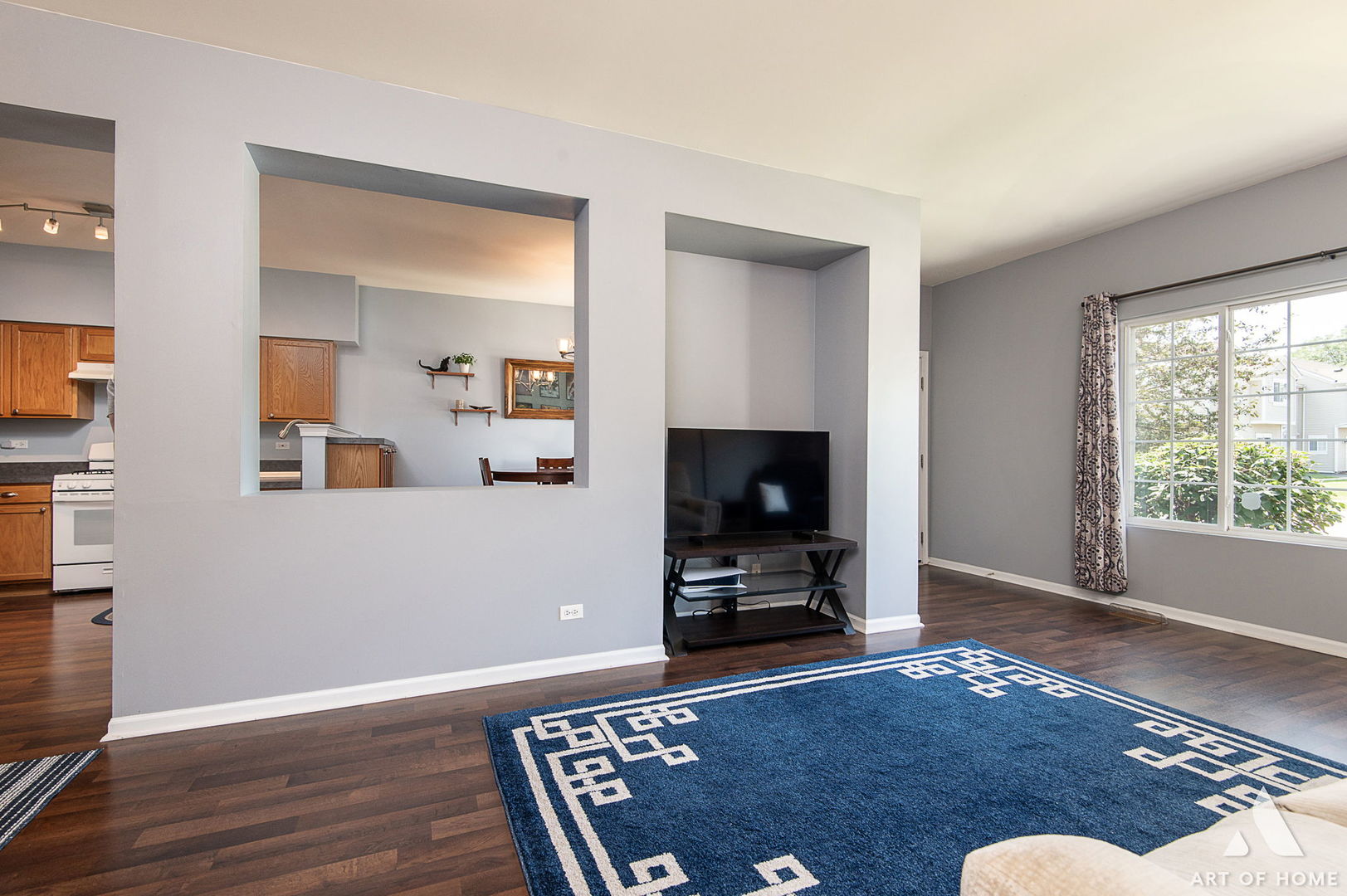 169 Braxton Lane Aurora, IL 60504 - Photo 8 of 26 a living room with furniture and a flat screen tv