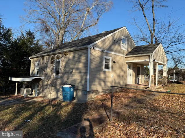 a front view of a house with parking area