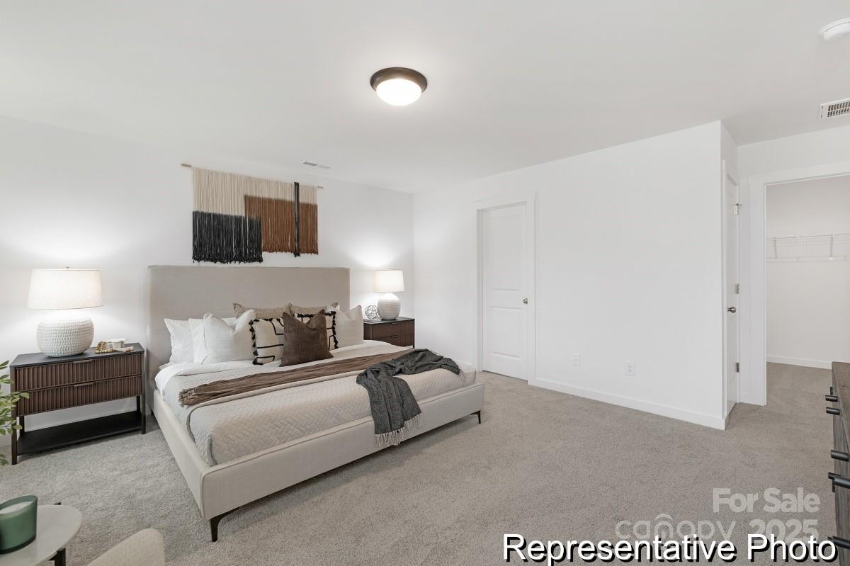 128 Peak Vw Road, Unit 5P Statesville, NC 28677 - Photo 16 of 28 a bedroom with a bed and a television