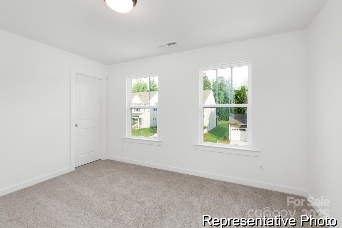 128 Peak Vw Road, Unit 5P Statesville, NC 28677 - Photo 19 of 28 an empty room with windows