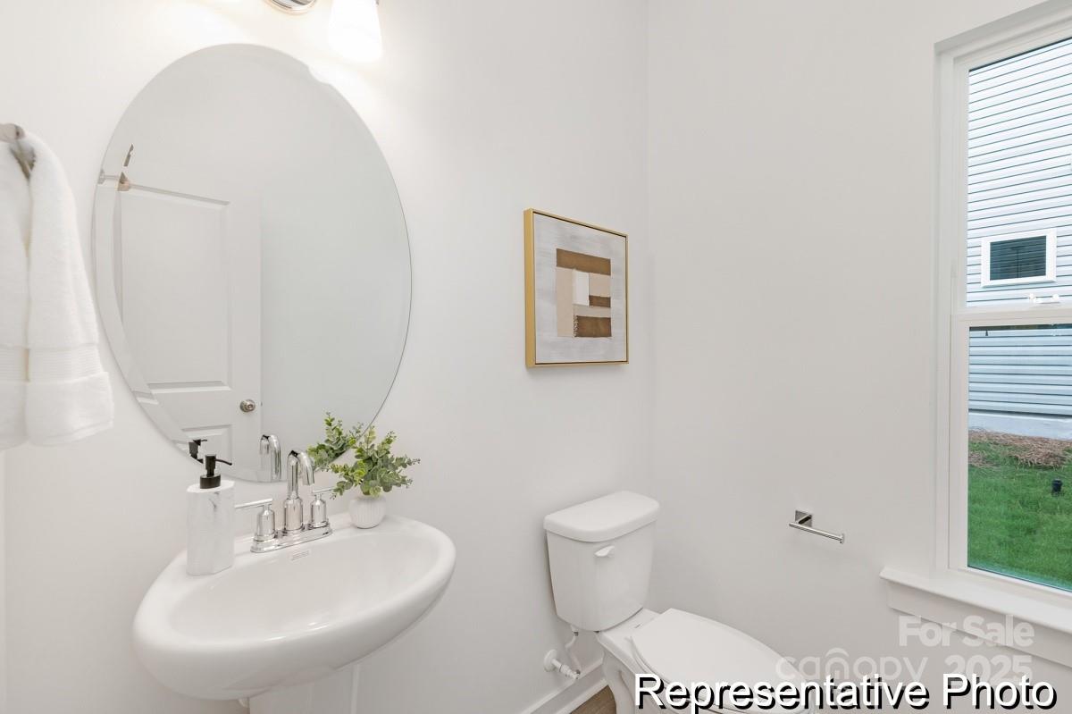 128 Peak Vw Road, Unit 5P Statesville, NC 28677 - Photo 26 of 28 a bathroom with a sink and a mirror