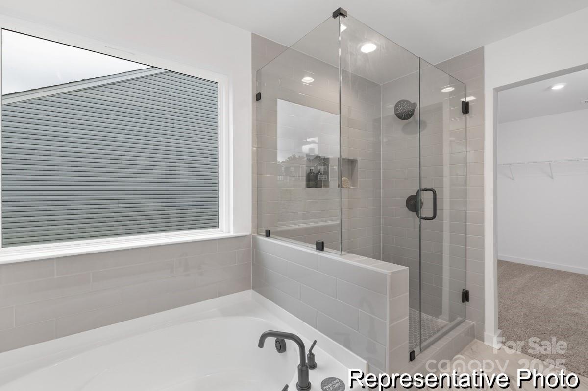 128 Peak Vw Road, Unit 5P Statesville, NC 28677 - Photo 27 of 28 a bathroom with a bathtub and a shower