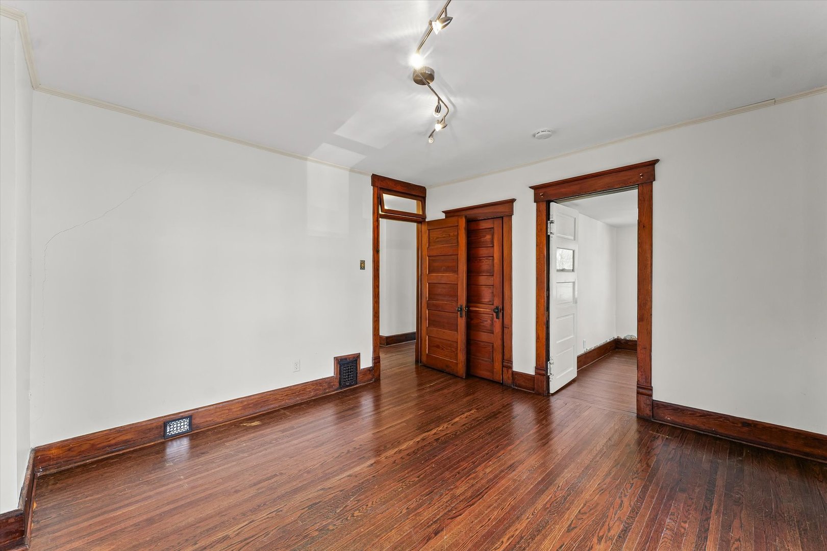 407 West High Street Urbana, IL 61801 - Photo 15 of 28 an empty room with wooden floor and closet