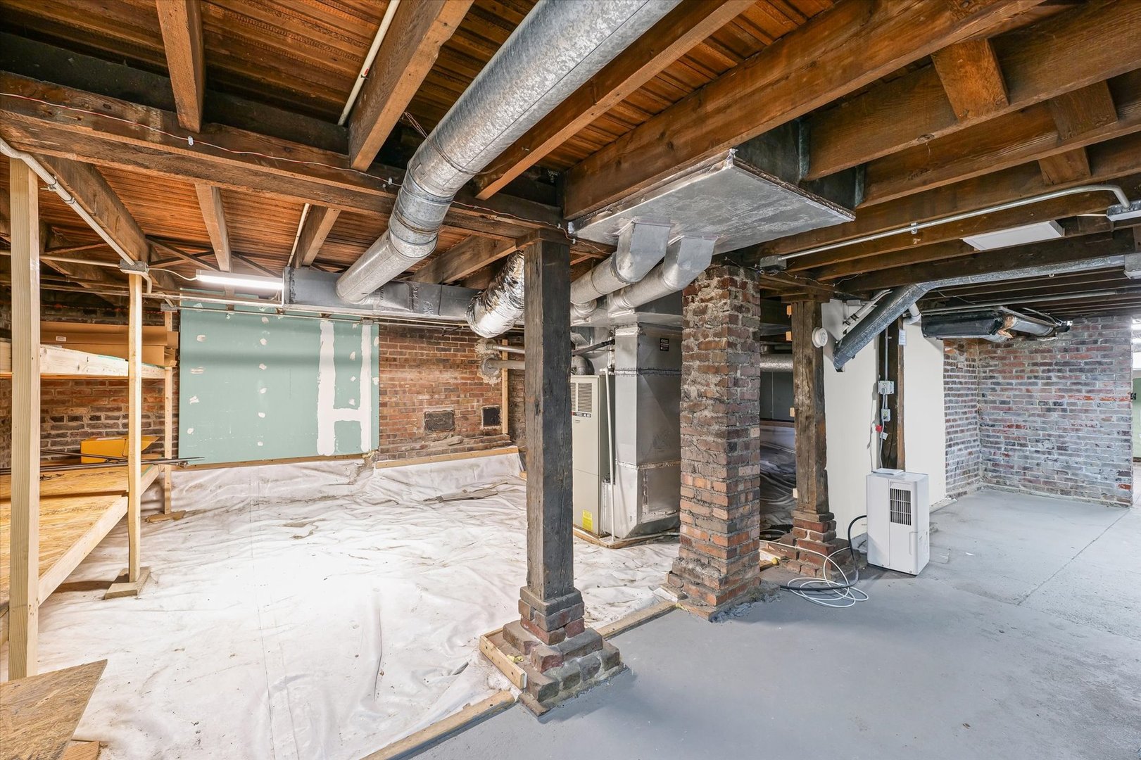 407 West High Street Urbana, IL 61801 - Photo 27 of 28 a view of garage with wooden floor and chair