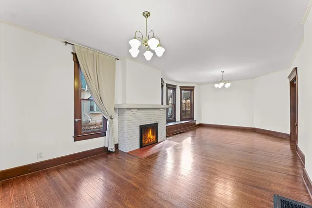 a kitchen with stainless steel appliances granite countertop wooden cabinets a stove top oven a sink and dishwasher