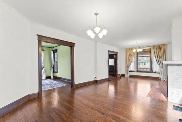 a kitchen with stainless steel appliances granite countertop a refrigerator a stove top oven a sink and dishwasher