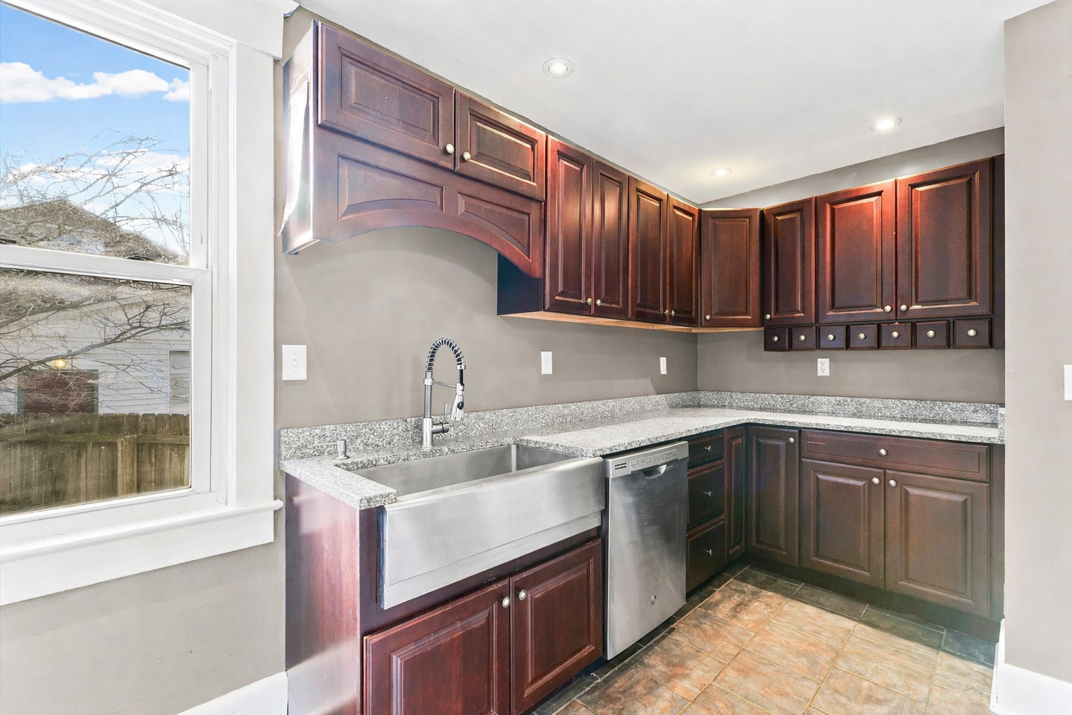 407 West High Street Urbana, IL 61801 - Photo 9 of 28 a kitchen with a sink stove and cabinets