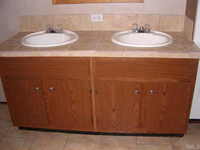 1206 Massenburg Road Henderson, NC 27537 - Photo 4 of 10 CERAMIC TILE COUNTERTOP IN MASTER BATHROOM