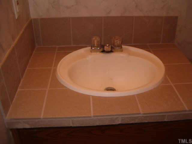 1206 Massenburg Road Henderson, NC 27537 - Photo 6 of 10 CERAMIC TILE COUTEROP IN 2ND BATHROOM
