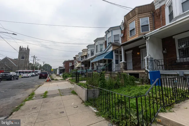 a view of a building with sitting area