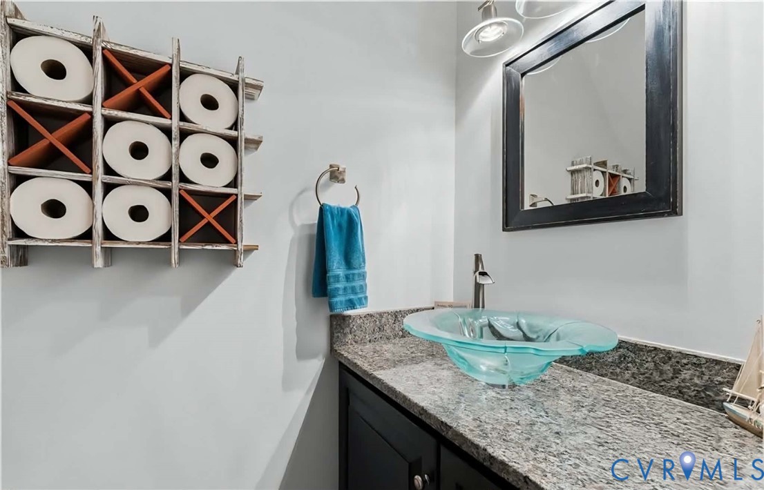 14321 Crossings Ridge Drive Midlothian, VA 23113 - Photo 17 of 43 a bathroom with a granite countertop sink and a mirror
