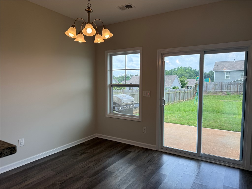 117 Weaver Way Pendleton, SC 29670 - Photo 7 of 19 A welcoming eat-in kitchen area features a glass sliding door for convenient outdoor access.