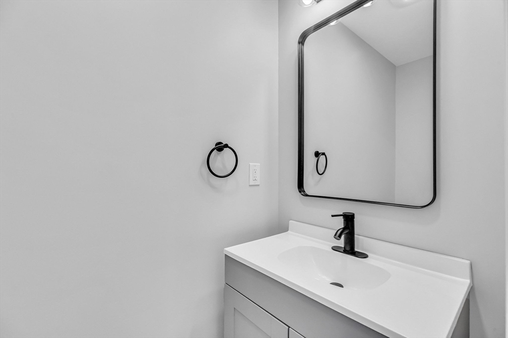 213 Pine Street, Unit 213 Springfield, MA 01105 - Photo 17 of 25 a bathroom with a sink and a mirror