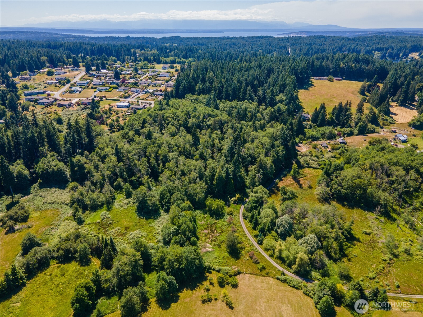 0 East Heggeness Road Clinton, WA 98236 - Photo 18 of 19 a view of a lake with a mountain