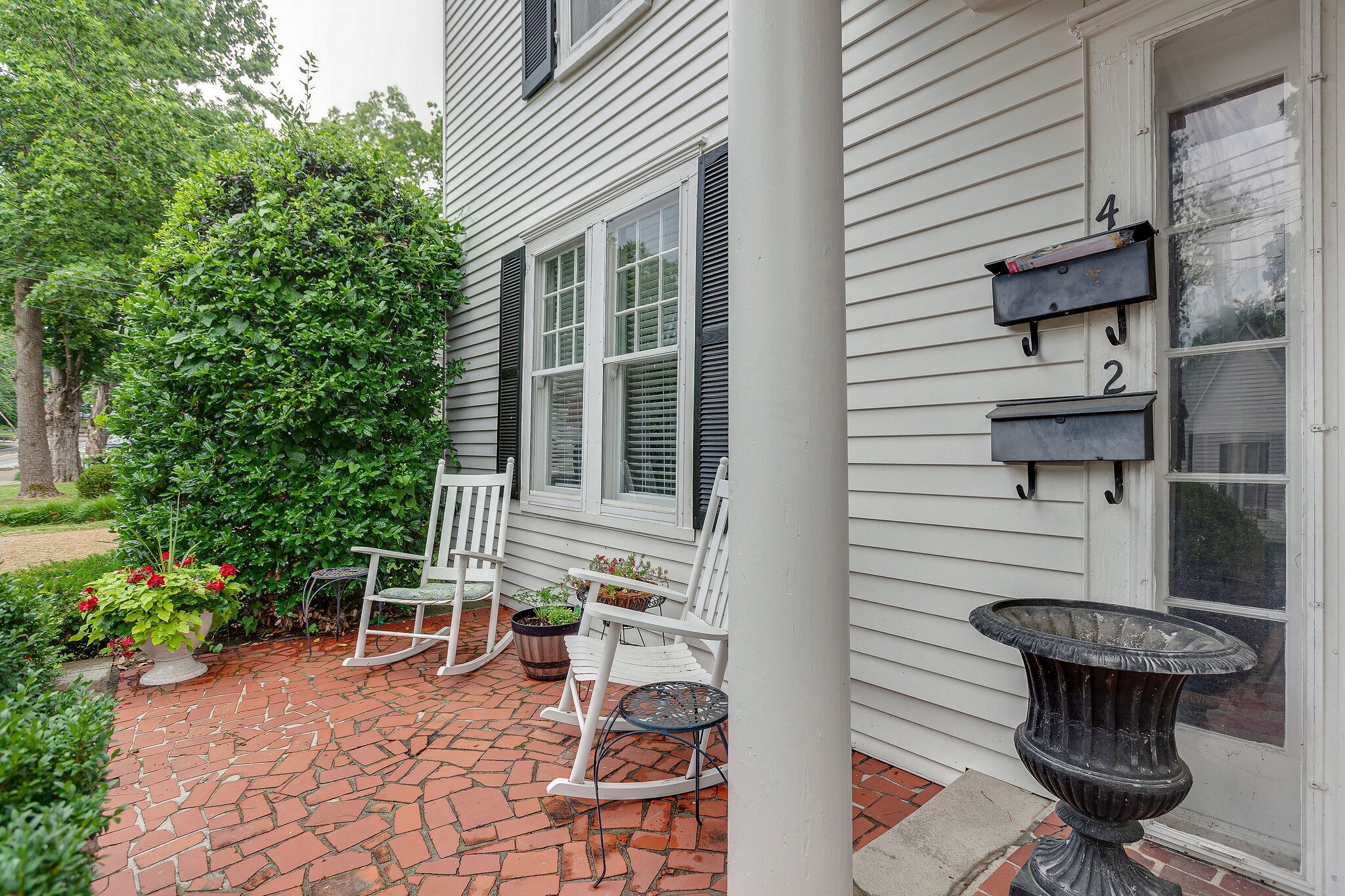 210 5th Avenue South, Unit 2 Franklin, TN 37064 - Photo 2 of 21 a backyard of a house with outdoor seating