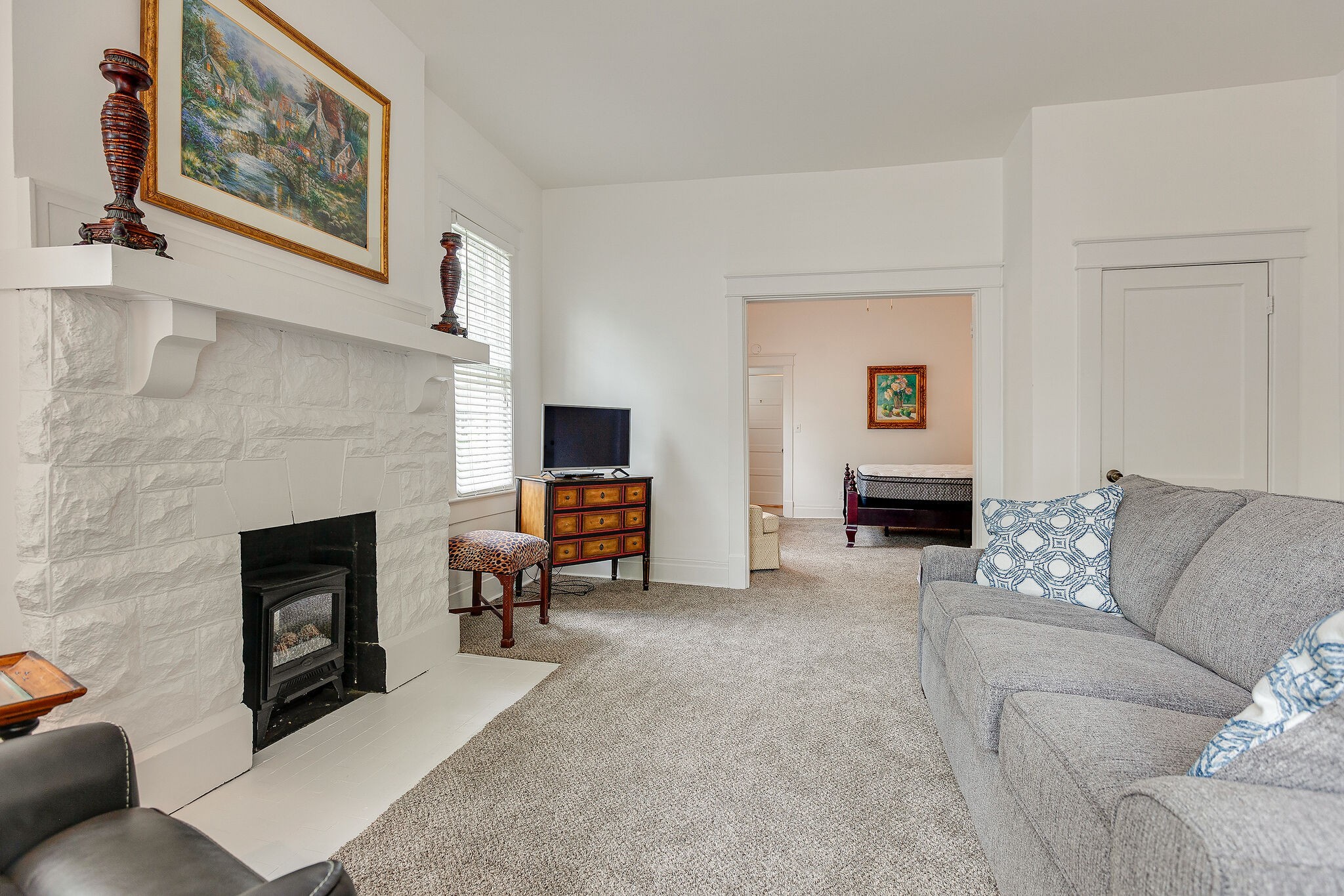 210 5th Avenue South, Unit 2 Franklin, TN 37064 - Photo 6 of 21 a living room with furniture a flat screen tv and a fireplace