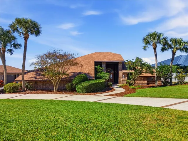 a kitchen view with stainless steel appliances granite countertop a sink a stove and a refrigerator