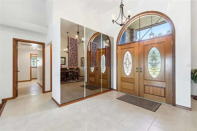 a living room with furniture fireplace and wooden floor