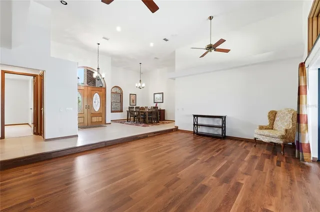 a living room with furniture a rug and a fireplace
