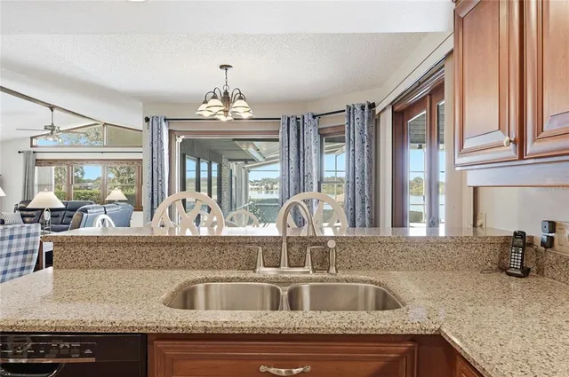 a bed room with a bed and a chandelier