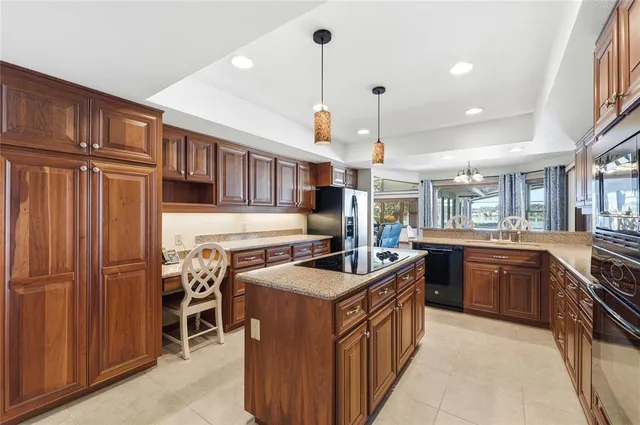 a spacious bathroom with a tub sink double vanity and window