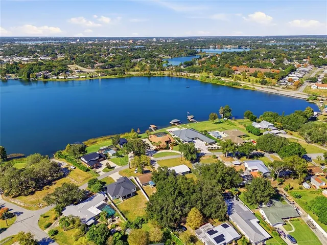 an aerial view of multiple house with yard swimming pool and outdoor seating
