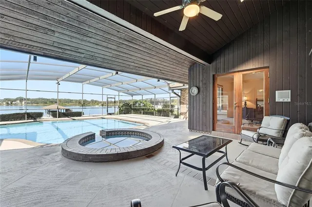 a view of a swimming pool with a yard