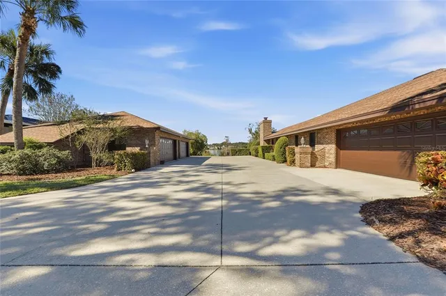 a front view of a house with porch and garden