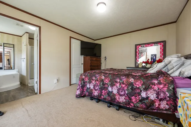 a bedroom with furniture and a bed