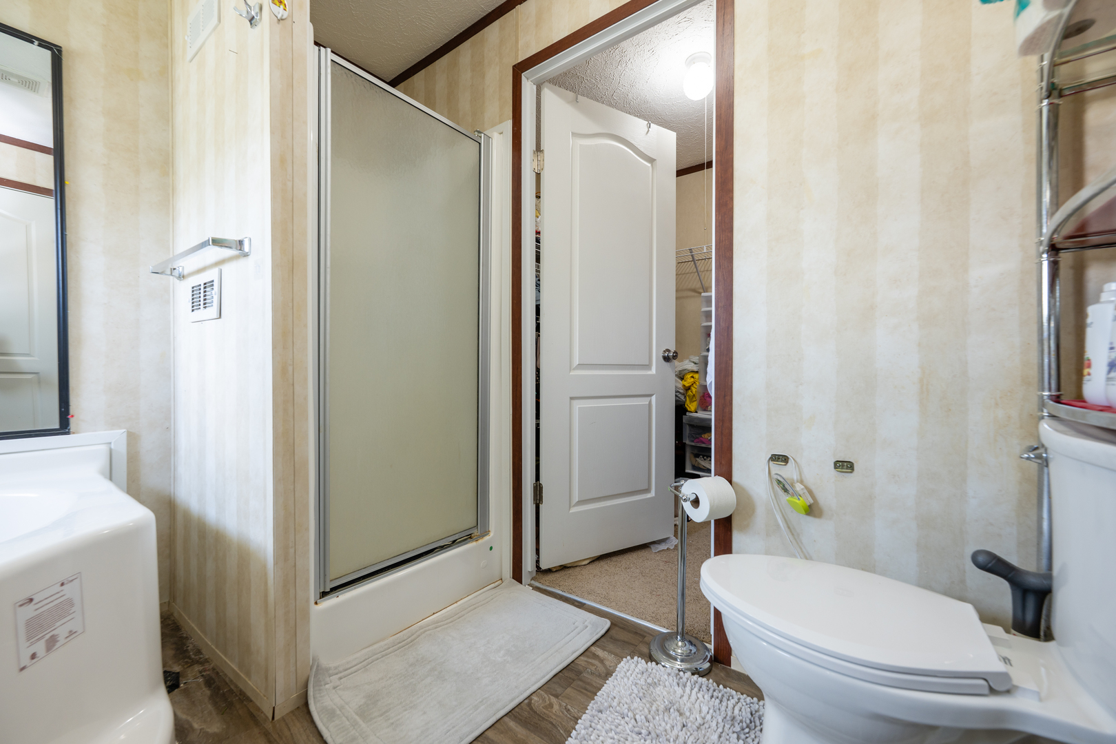 4809 West Windsor Road, Unit G22 Champaign, IL 61822 - Photo 16 of 22 a bathroom with a toilet and a shower