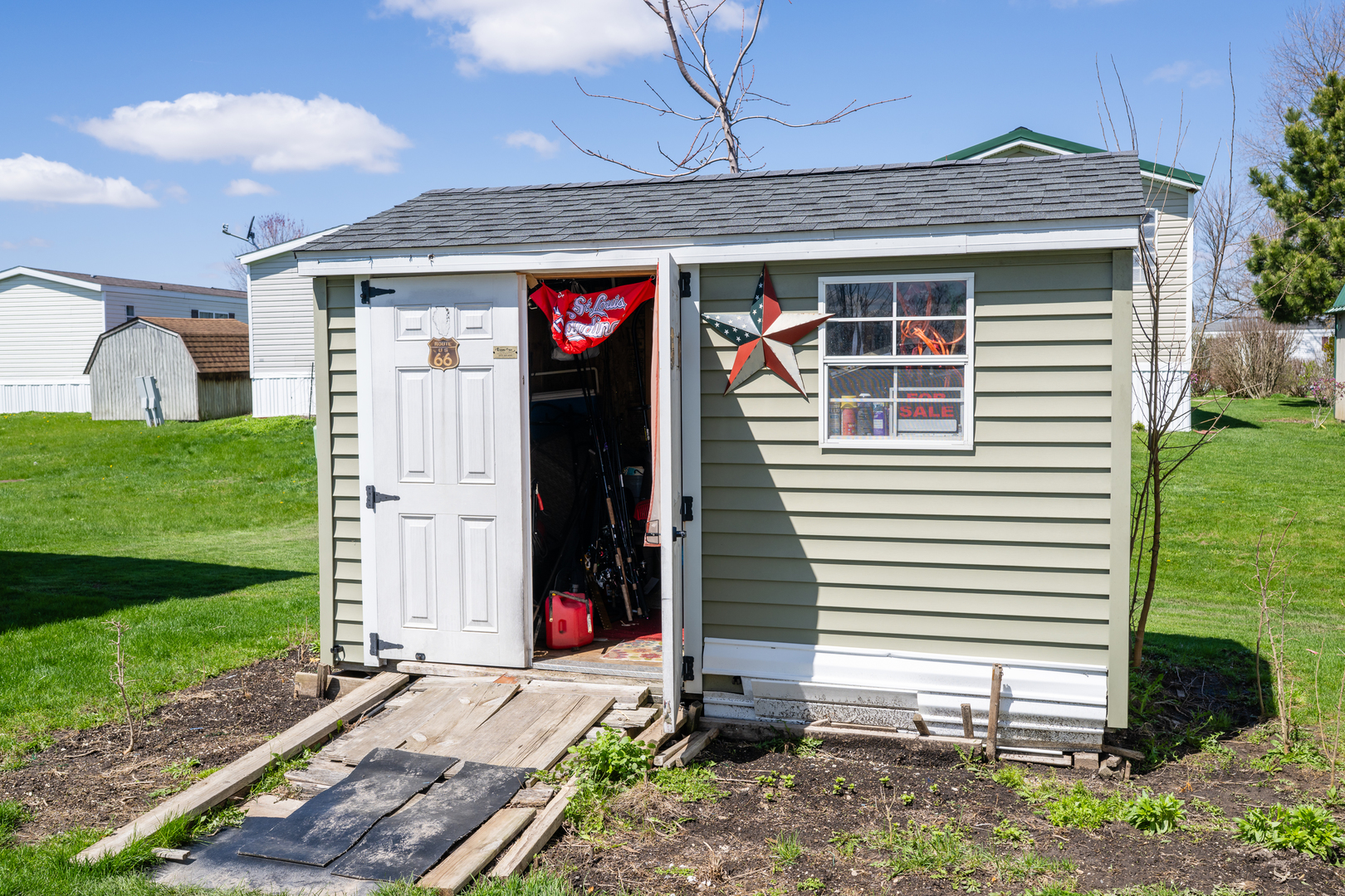 4809 West Windsor Road, Unit G22 Champaign, IL 61822 - Photo 22 of 22 a front view of a house with garden