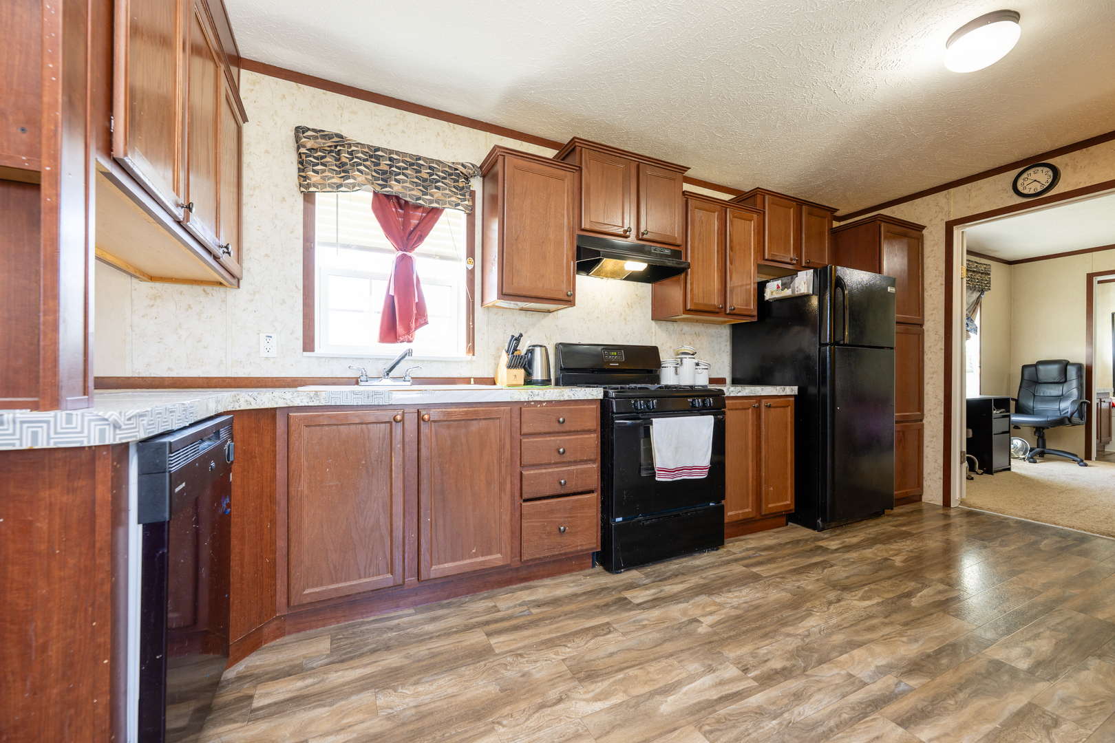 4809 West Windsor Road, Unit G22 Champaign, IL 61822 - Photo 7 of 22 a kitchen with stainless steel appliances a refrigerator and a sink