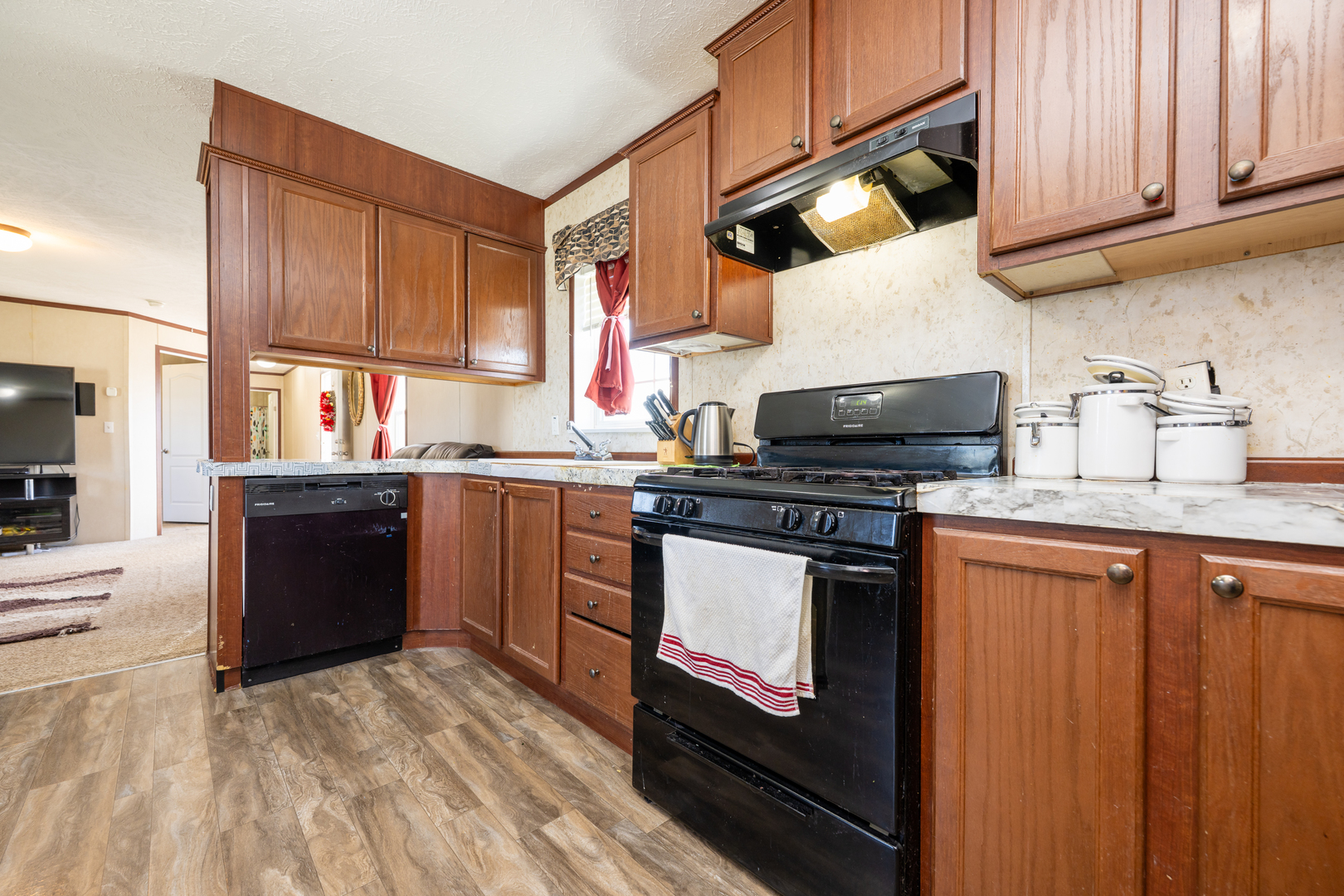4809 West Windsor Road, Unit G22 Champaign, IL 61822 - Photo 8 of 22 a kitchen with stainless steel appliances granite countertop a stove a sink and a microwave