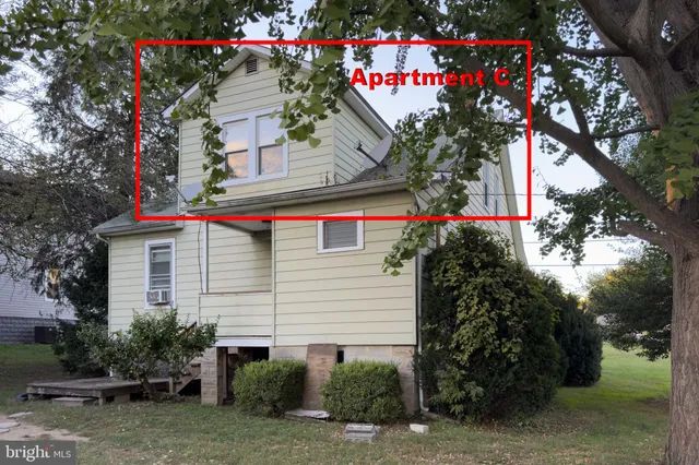 a front view of a house with yard