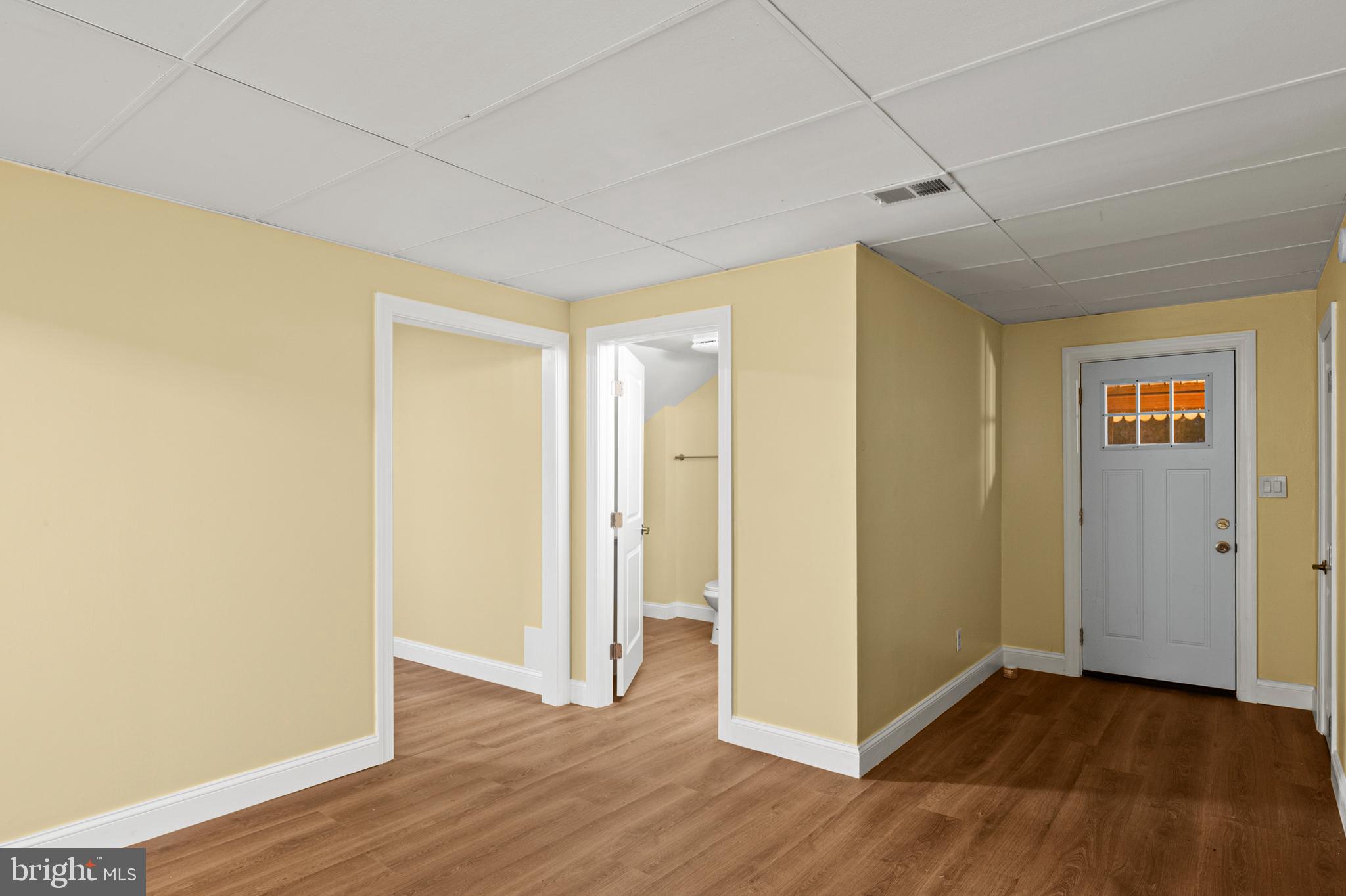 35 3rd Avenue, Unit C Halethorpe, MD 21227 - Photo 2 of 18 a view of an empty room with wooden floor