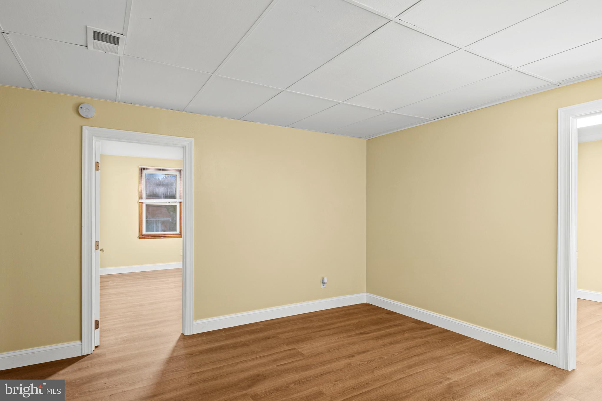 35 3rd Avenue, Unit C Halethorpe, MD 21227 - Photo 4 of 18 a view of an empty room with wooden floor