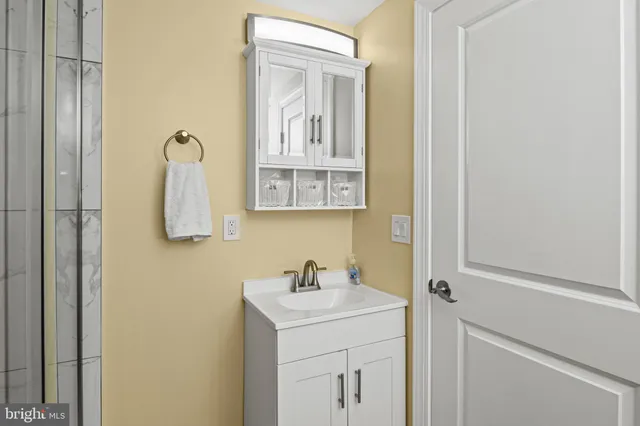 a bathroom with a sink and mirror