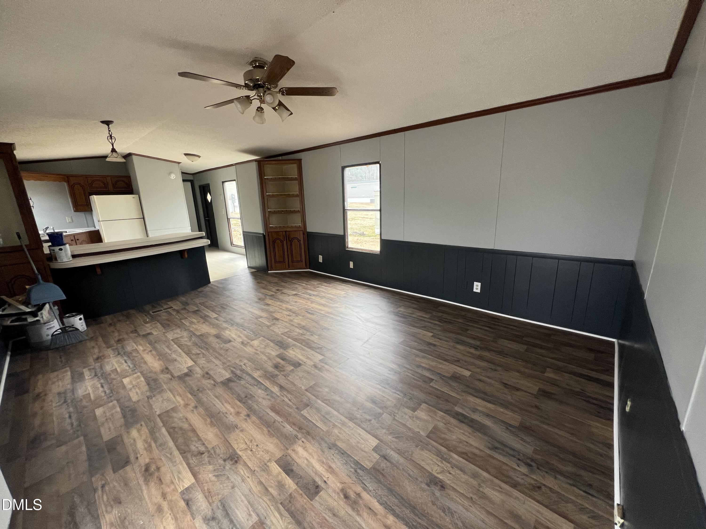 172 Pine Forest Loop Louisburg, NC 27549 - Photo 2 of 9 wooden floor in an empty room with a window