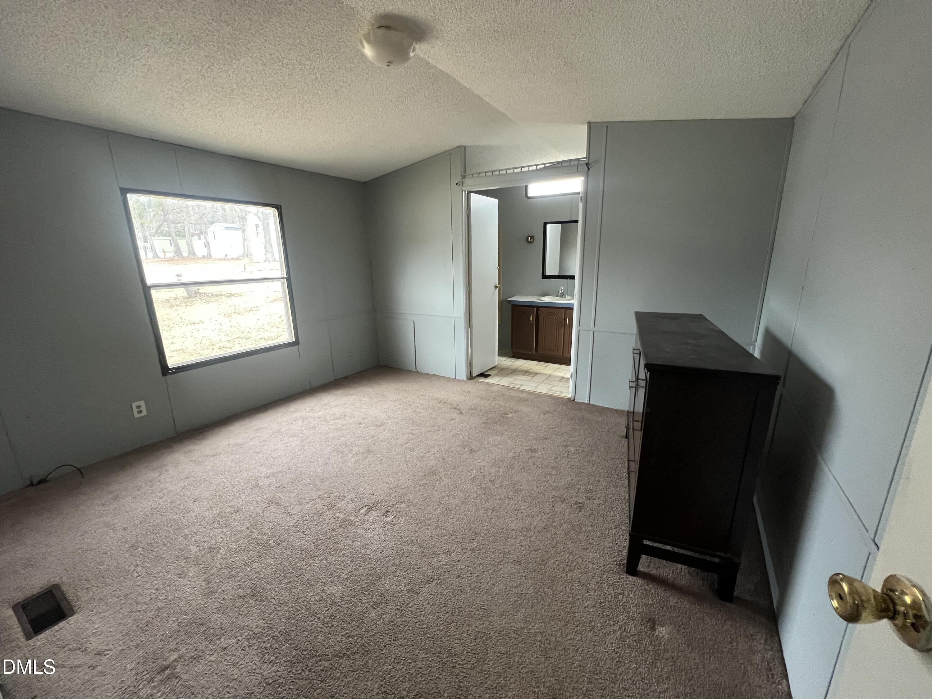 172 Pine Forest Loop Louisburg, NC 27549 - Photo 5 of 9 an empty room with windows