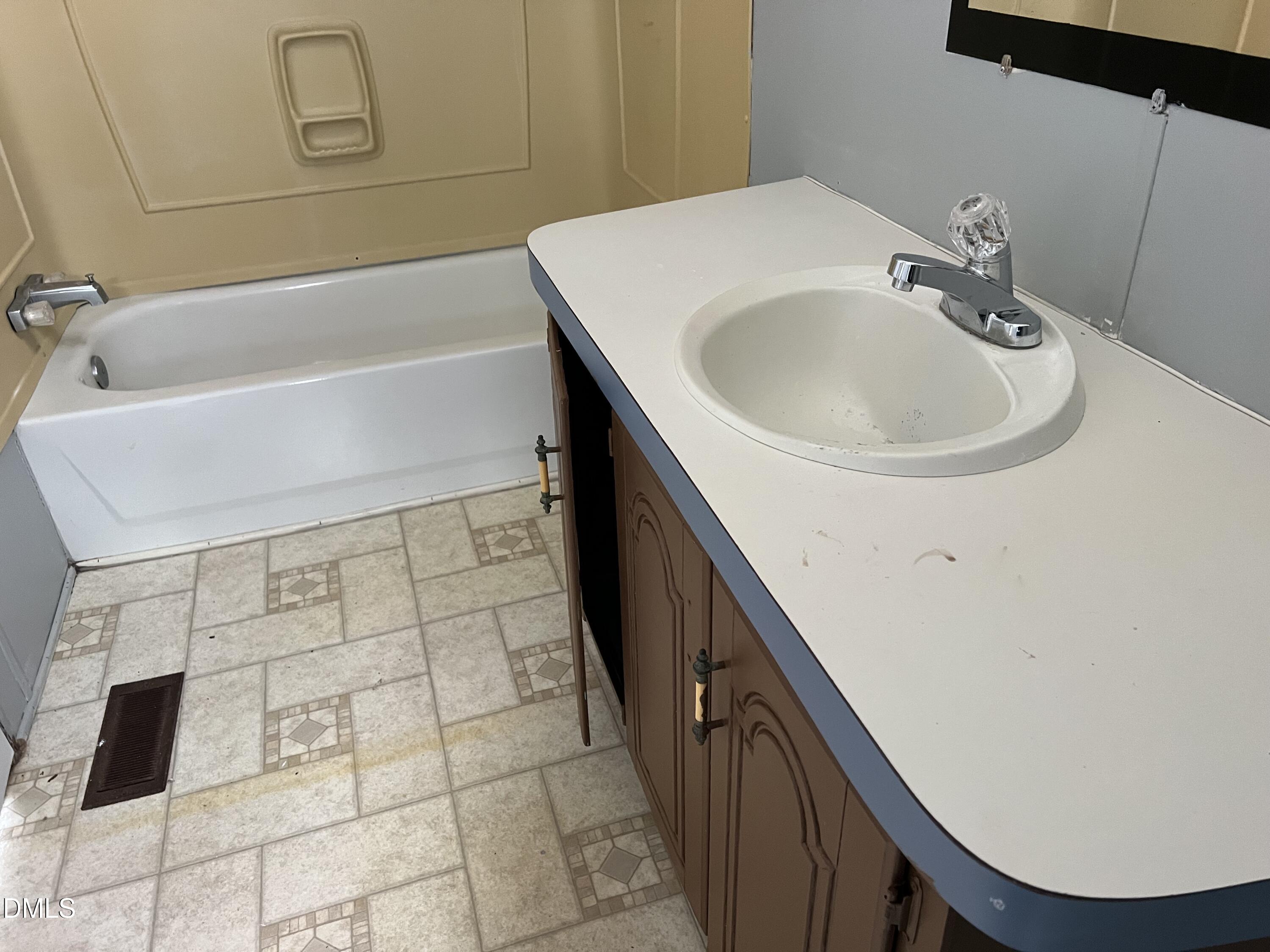 172 Pine Forest Loop Louisburg, NC 27549 - Photo 6 of 9 a bathroom with a sink a toilet and shower