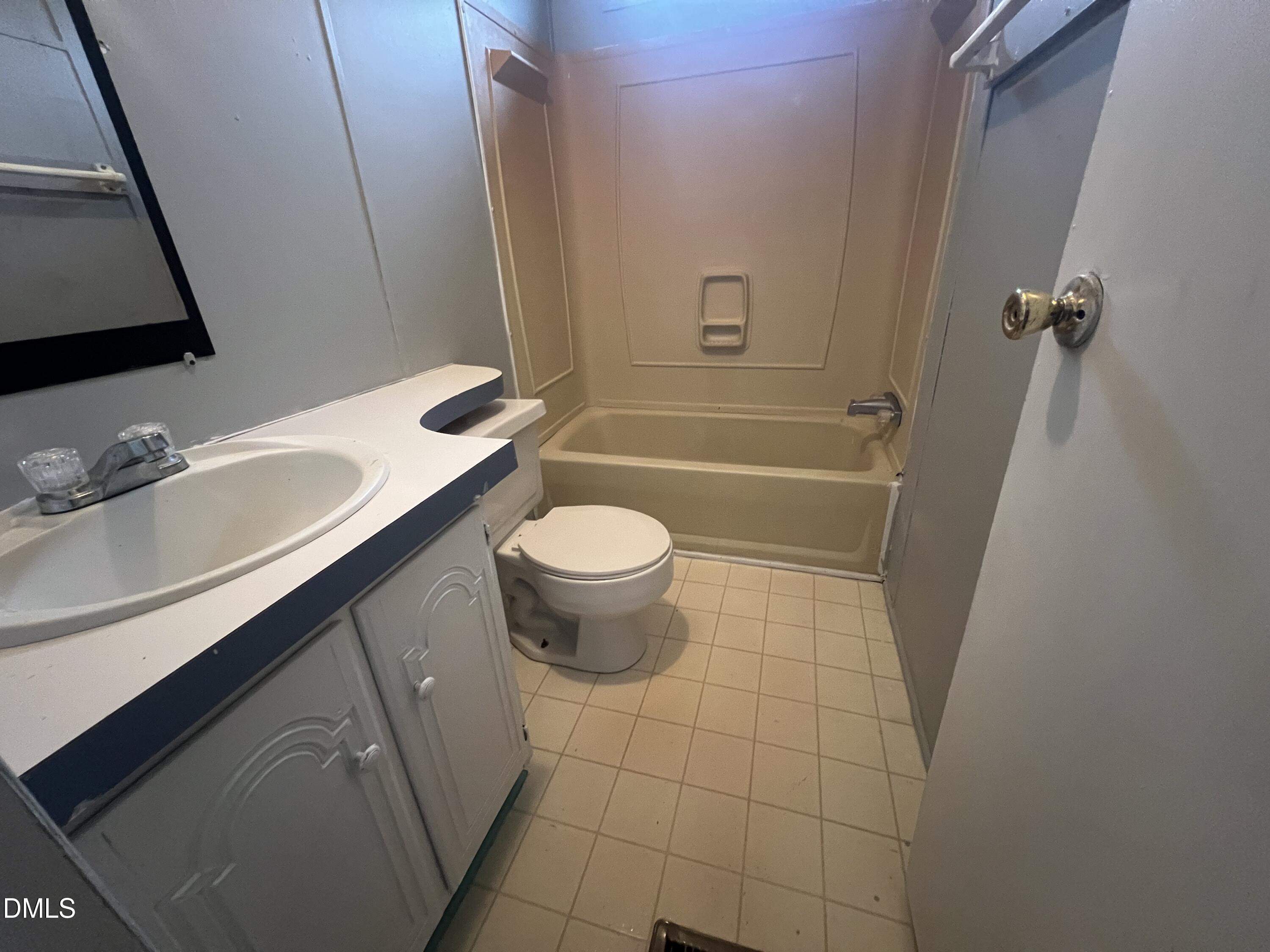 172 Pine Forest Loop Louisburg, NC 27549 - Photo 8 of 9 a bathroom with a sink a toilet and shower