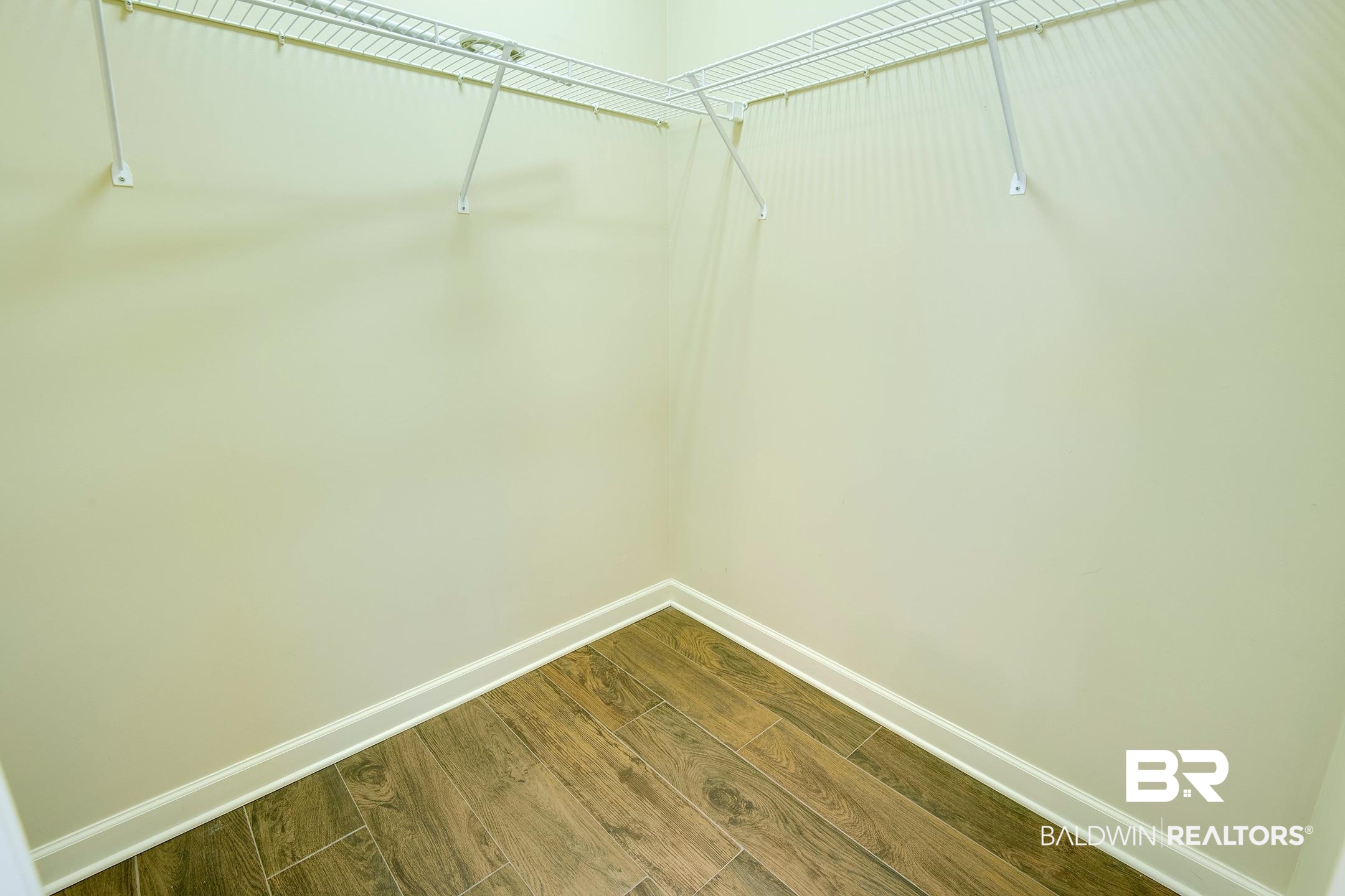 9421 Collier Loop Daphne, AL 36526 - Photo 28 of 31 Spacious closet with dark wood-type flooring