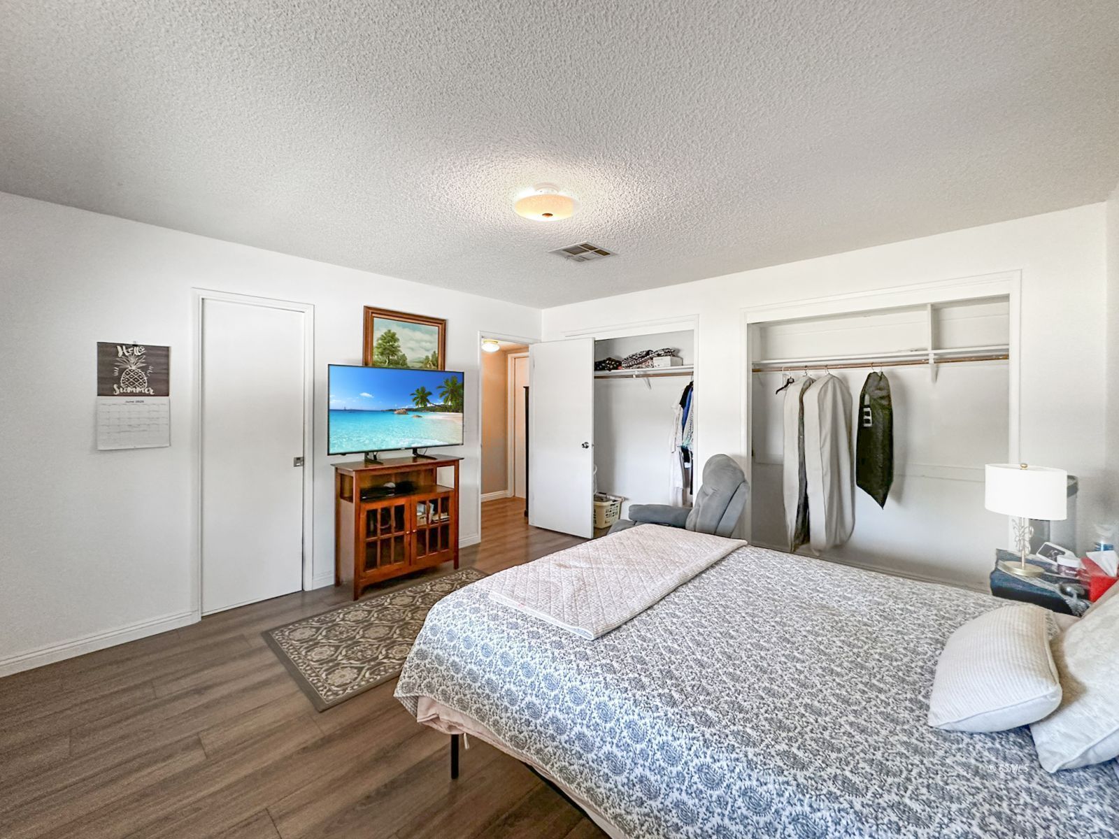 724 West Dolphin Avenue Ridgecrest, CA 93555 - Photo 25 of 50 a bedroom with a bed and a large mirror on the dresser