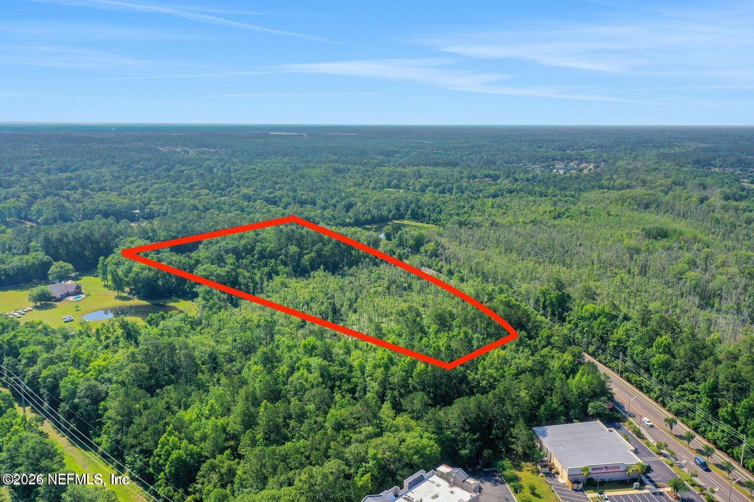10737 Crystal Springs Road Jacksonville, FL 32221 - Photo 3 of 6 a view of a lush green field