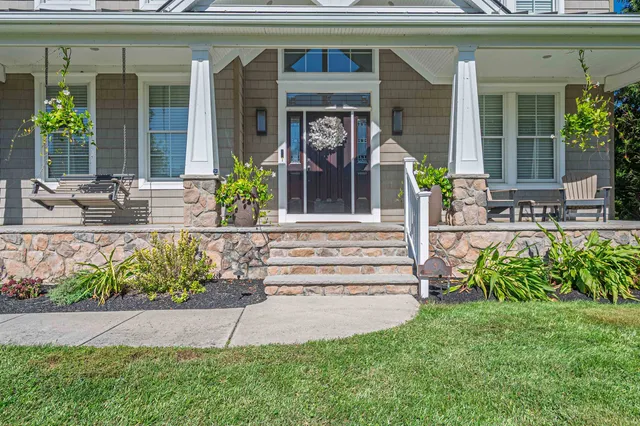 a front view of a house with garden