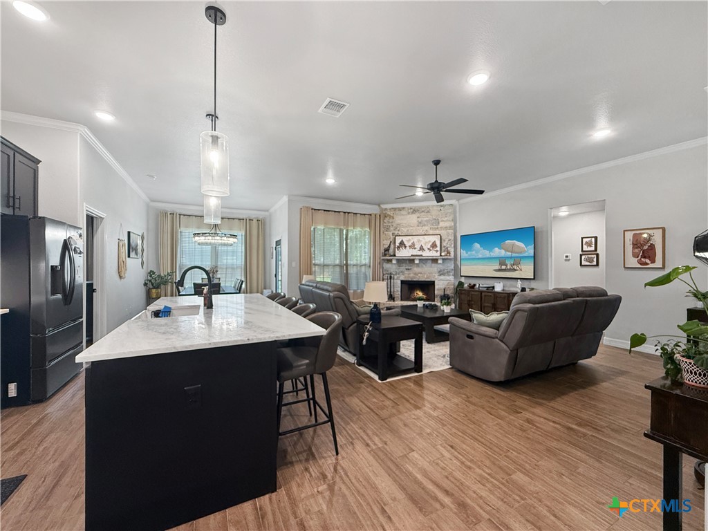 6123 Parma Lane Temple, TX 76502 - Photo 11 of 44 a living room with furniture a dining table and chairs